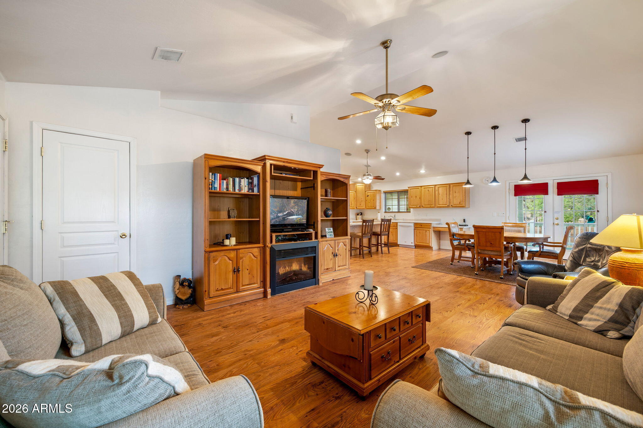 2236 Cross Country Road Overgaard, AZ 85933 - Photo 10 of 59 a living room with furniture kitchen view and a chandelier