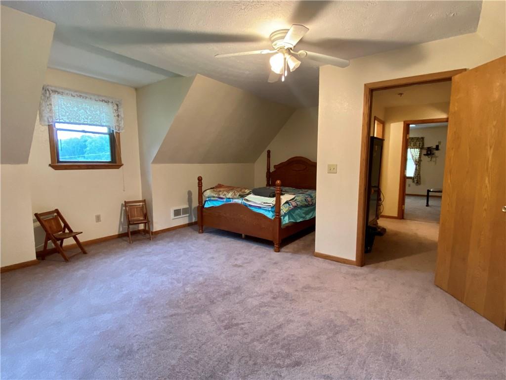 1564 Hells Kitchen Road Polk, PA 16342 - Photo 22 of 25 a view of a livingroom with furniture and a chandelier fan