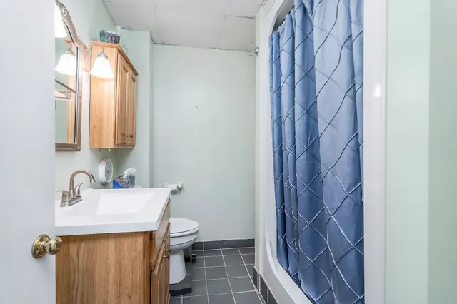 a bathroom with a sink and toilet