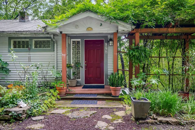 a front view of a house with garden