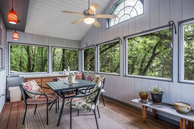 a view of a dining room with furniture window and outside view