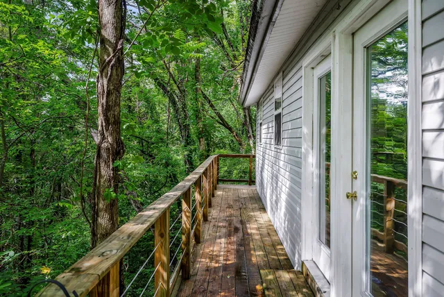 a view of a balcony with wooden floor