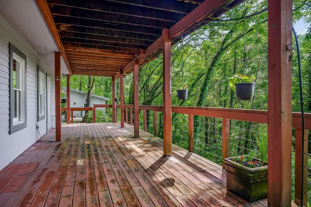 a view of a room with wooden floor and balcony