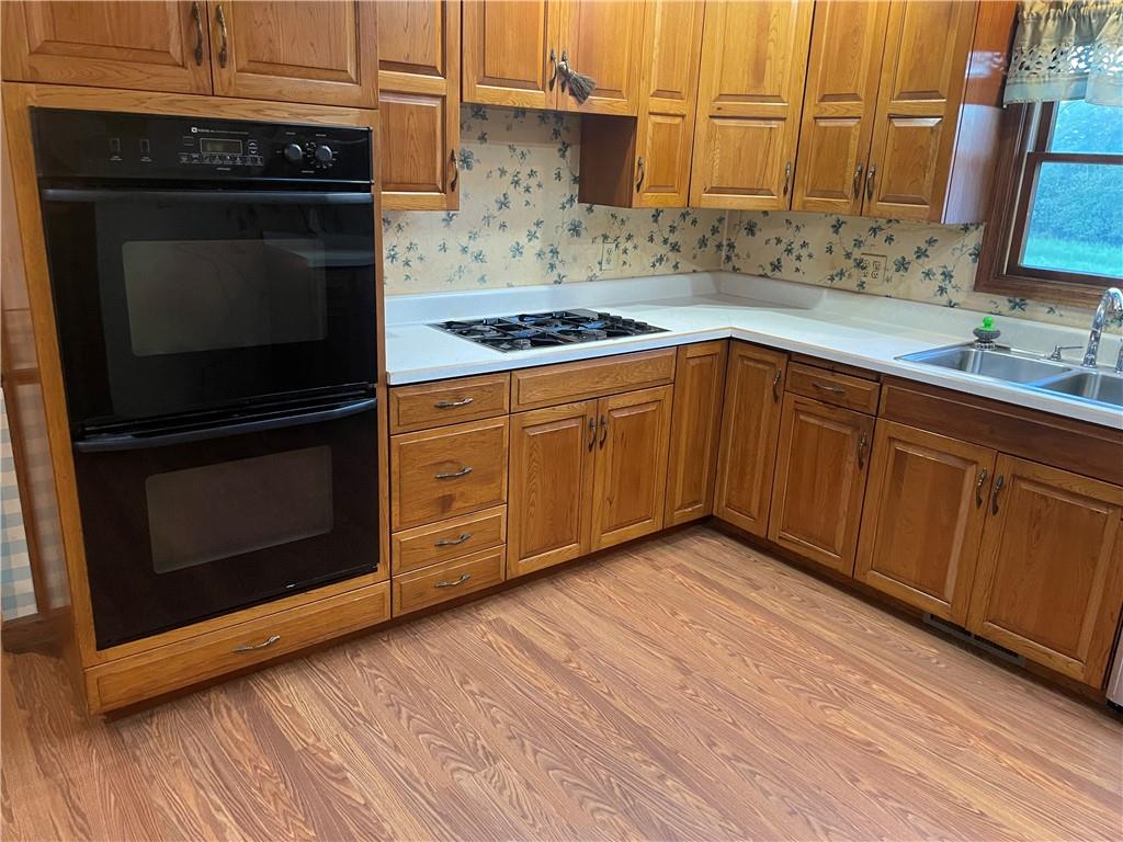 33 Hogue Road West Middlesex, PA 16159 - Photo 13 of 29 a kitchen with stainless steel appliances granite countertop a stove a sink and a microwave