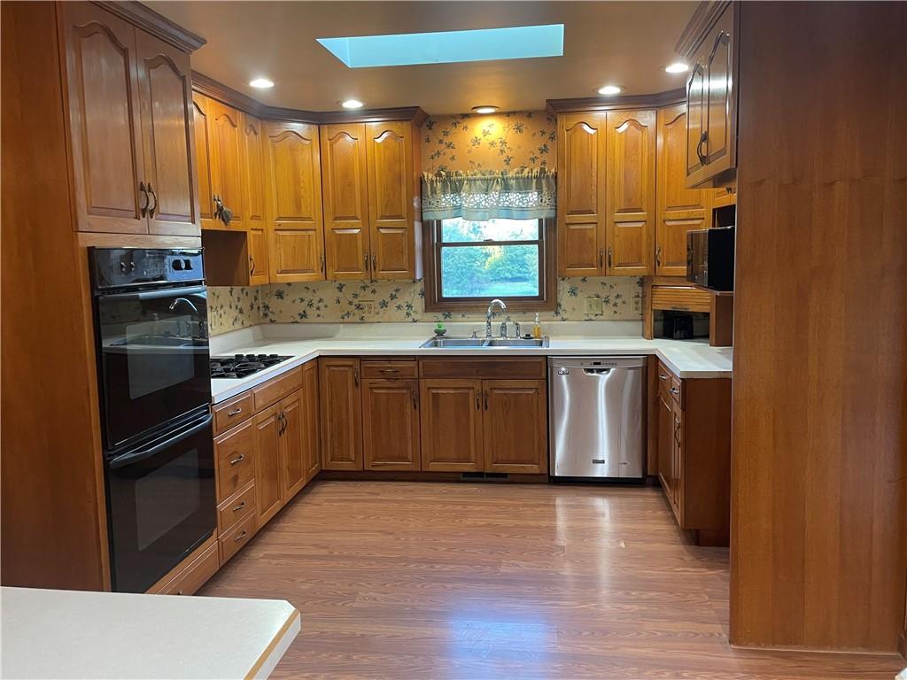 33 Hogue Road West Middlesex, PA 16159 - Photo 15 of 29 a kitchen with stainless steel appliances granite countertop a sink and a stove