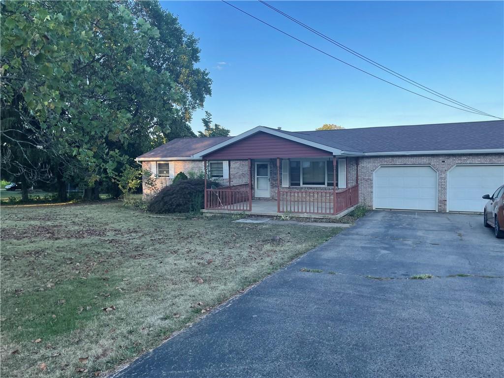 33 Hogue Road West Middlesex, PA 16159 - Photo 2 of 29 a front view of a house with garden