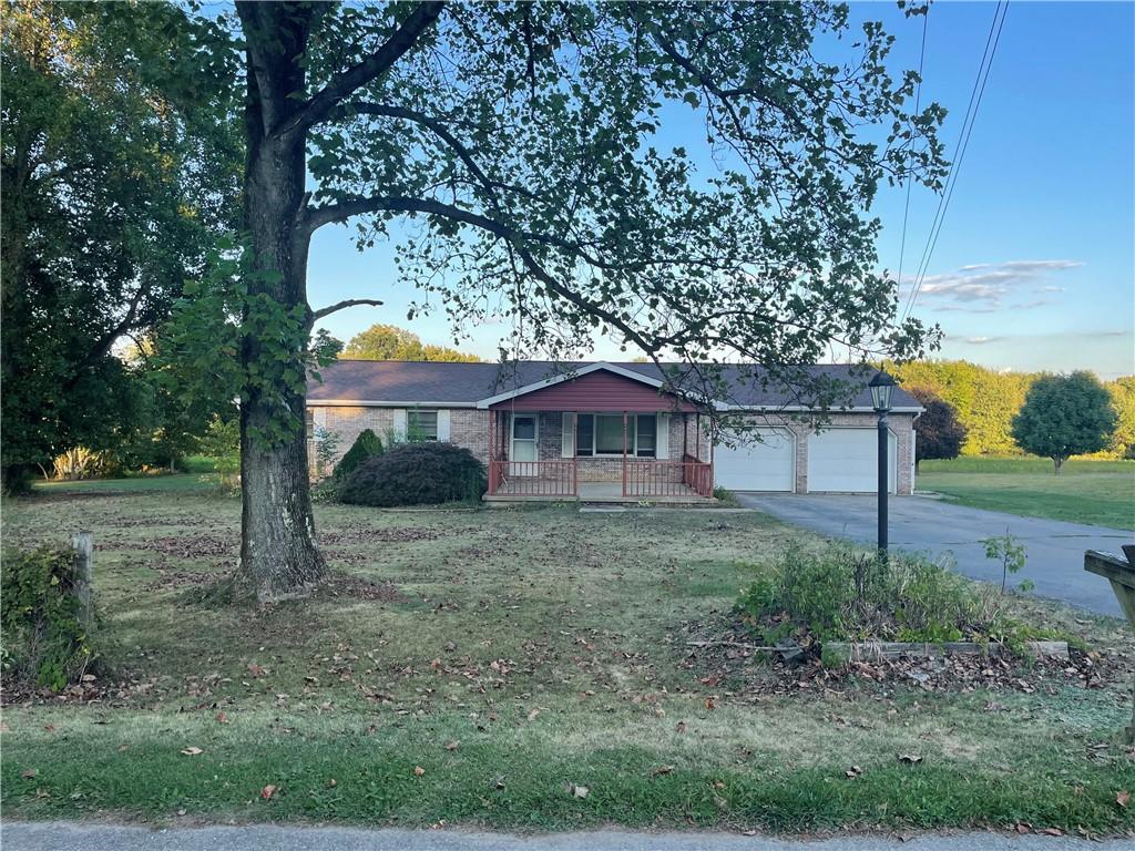 33 Hogue Road West Middlesex, PA 16159 - Photo 3 of 29 a view of a house with a yard and large tree