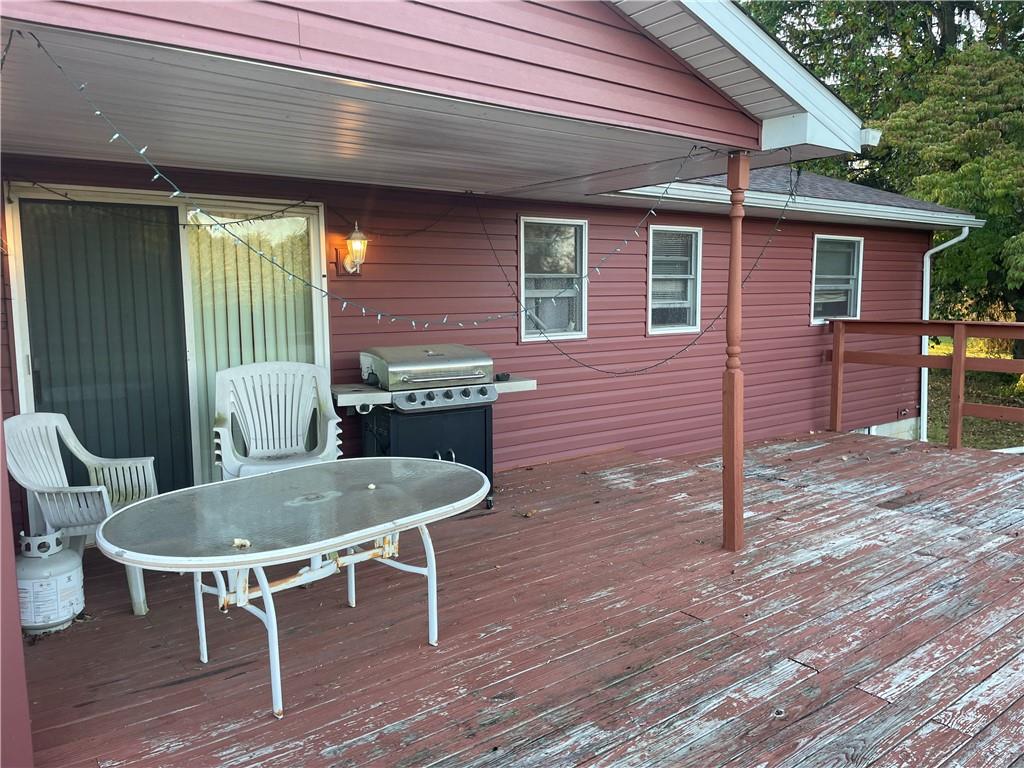 33 Hogue Road West Middlesex, PA 16159 - Photo 10 of 29 a backyard of a house with wooden floor table and chairs