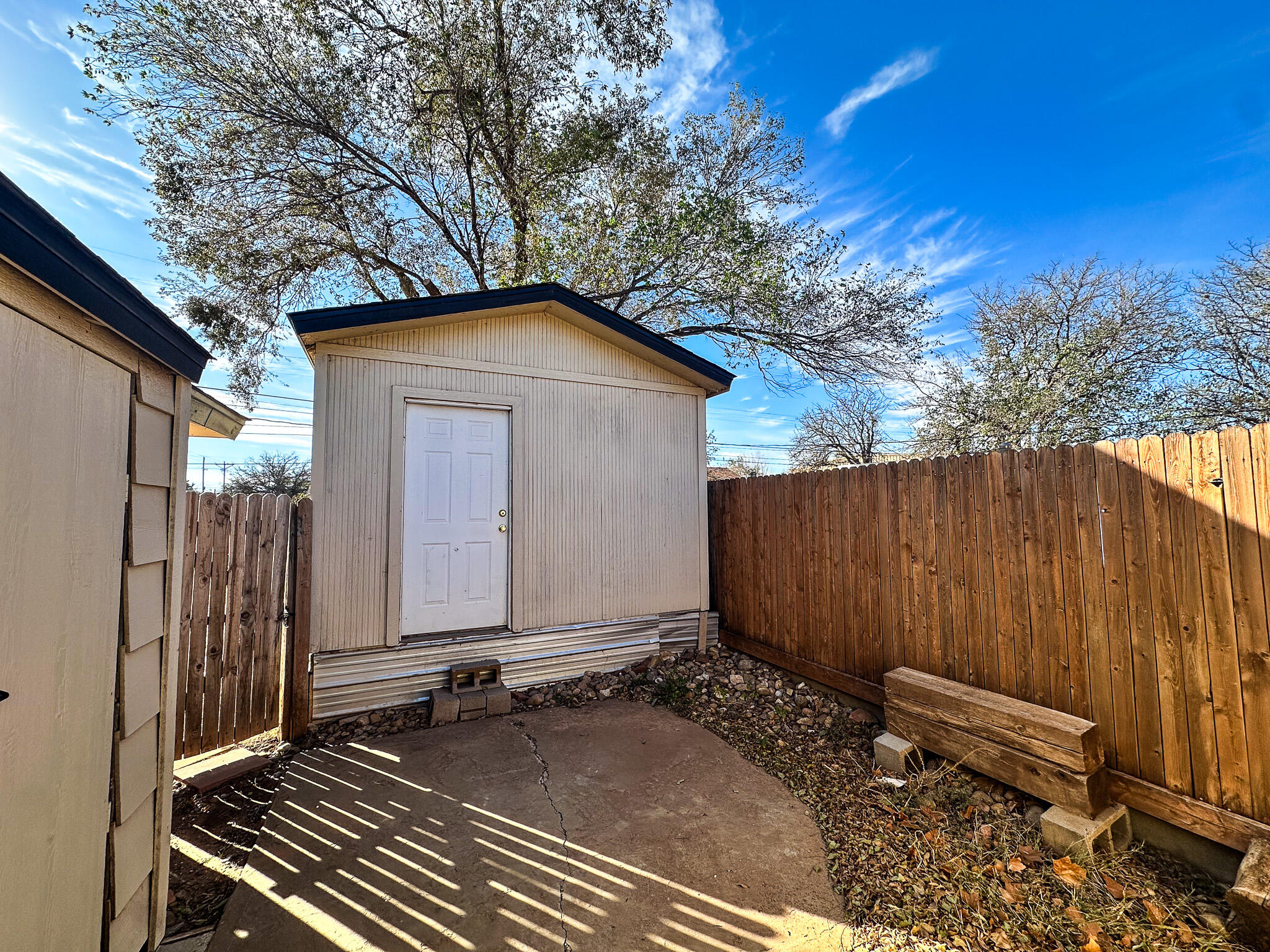 2101 48th Street Lubbock, TX 79412 - Photo 24 of 36 a front view of a house with a yard