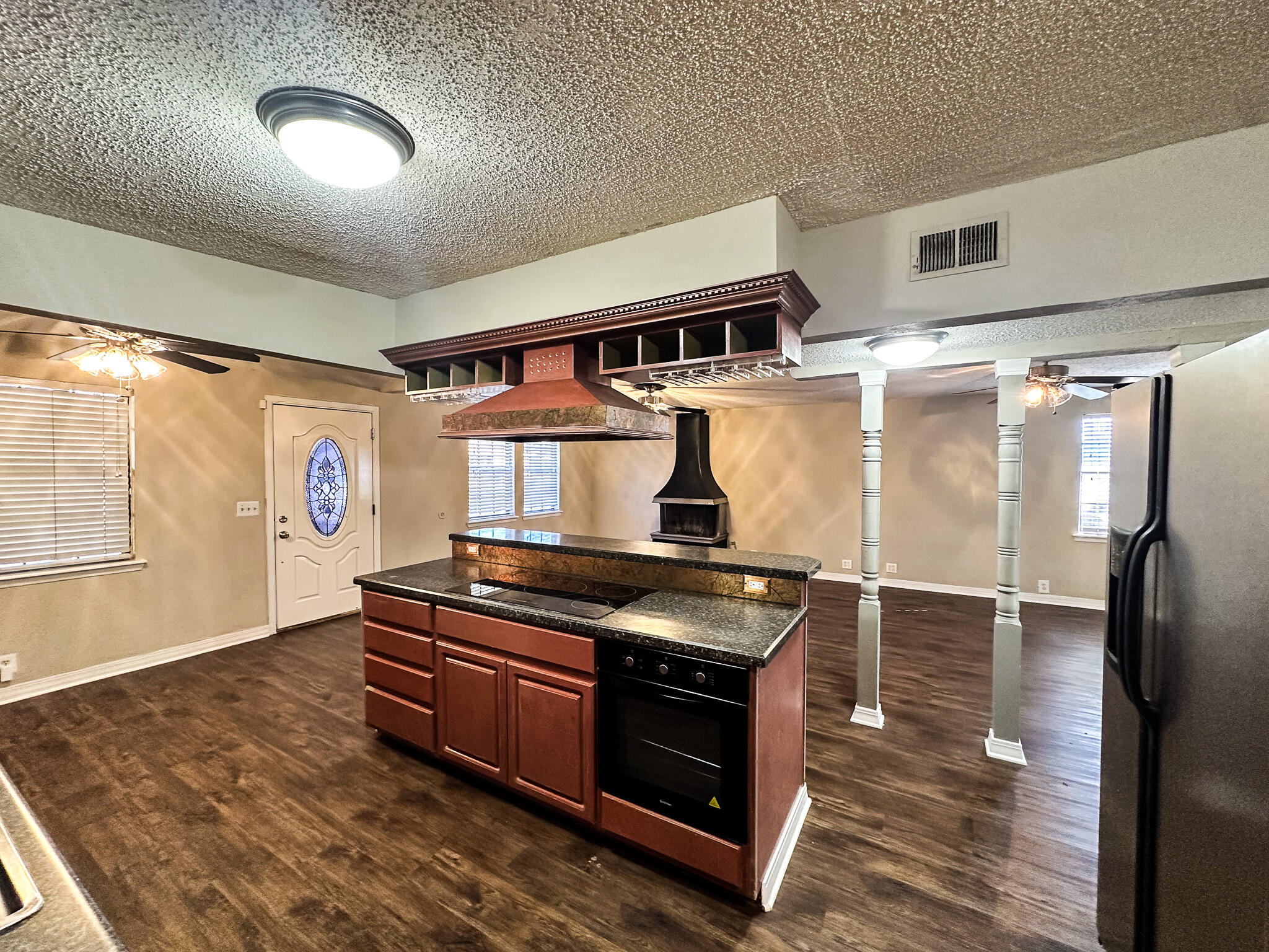 2101 48th Street Lubbock, TX 79412 - Photo 30 of 36 a kitchen with stainless steel appliances granite countertop a stove and a refrigerator