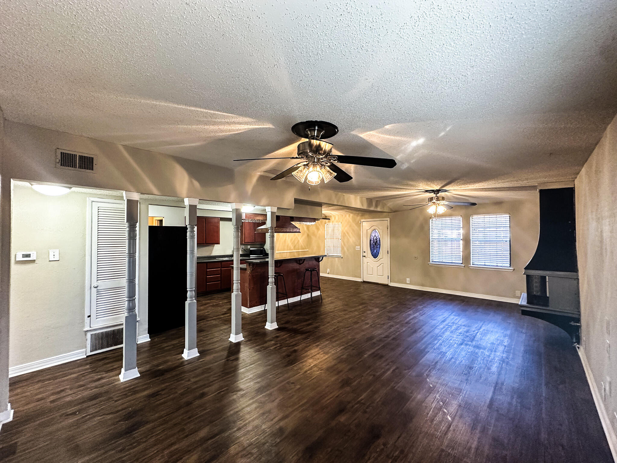 2101 48th Street Lubbock, TX 79412 - Photo 10 of 36 a view of a room with wooden floor