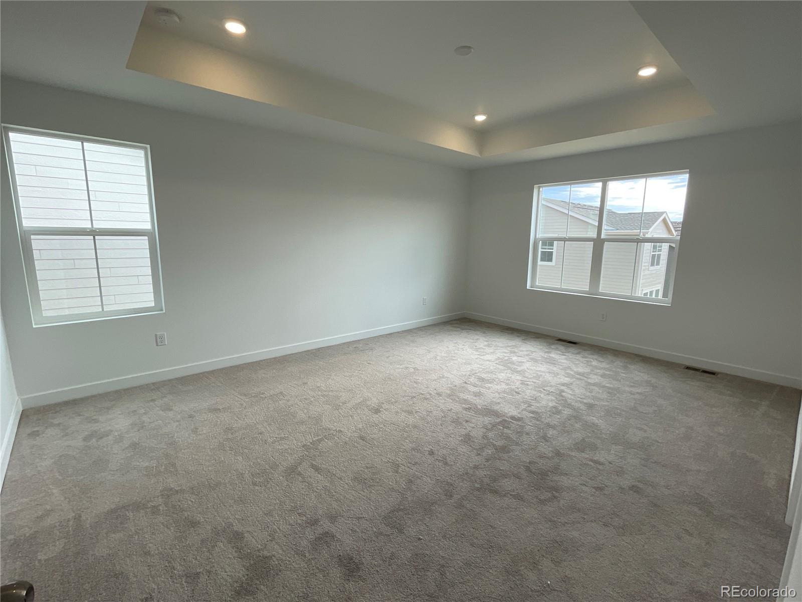 12880 Range Street Firestone, CO 80504 - Photo 5 of 21 an empty room with windows