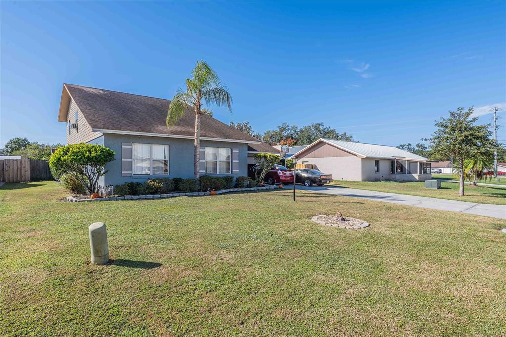 2221 Eastmeadows Road Lakeland, FL 33812 - Photo 2 of 39 a front view of house with outdoor space and swimming pool