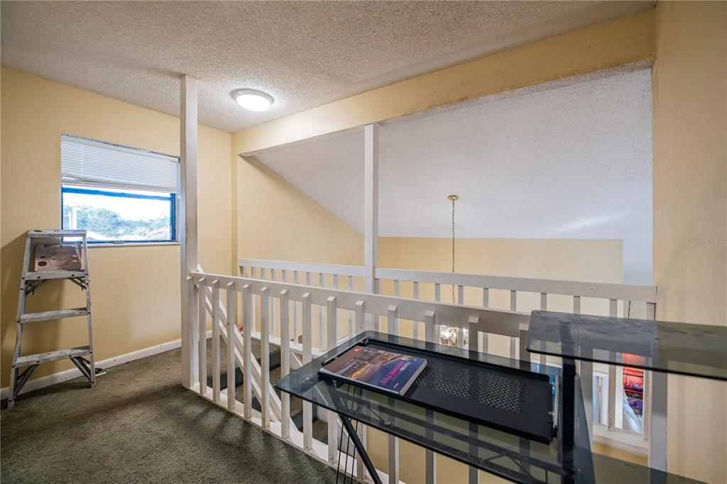 2221 Eastmeadows Road Lakeland, FL 33812 - Photo 23 of 39 a view of a balcony with furniture and window