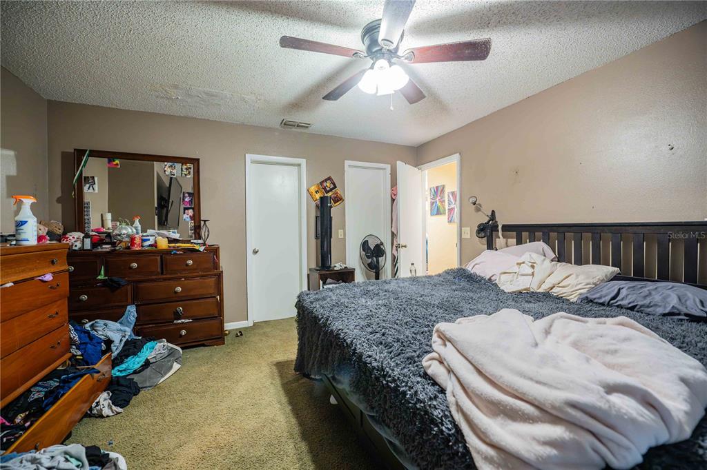 2221 Eastmeadows Road Lakeland, FL 33812 - Photo 27 of 39 a bed room with a bed and a mirror