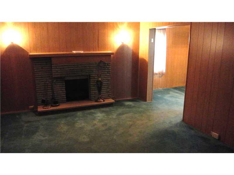 5409 Library Road Bethel Park, PA 15102 - Photo 5 of 24 Living Room. 17x13 Gas Log fireplace. 2 stained glass windows behind the panaling!