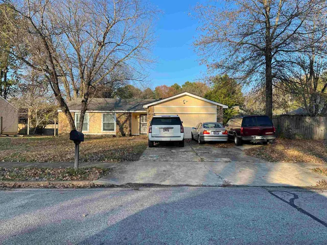 a car parked in front of a house