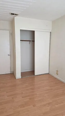 a view of empty room with closet area