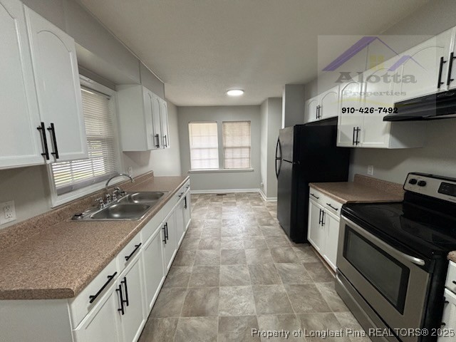 1810 Murchison Road Fayetteville, NC 28301 - Photo 3 of 10 a kitchen with stainless steel appliances granite countertop a stove a sink and a refrigerator