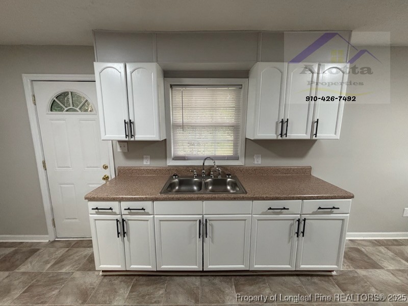 1810 Murchison Road Fayetteville, NC 28301 - Photo 4 of 10 a white stove top oven sitting inside of a kitchen