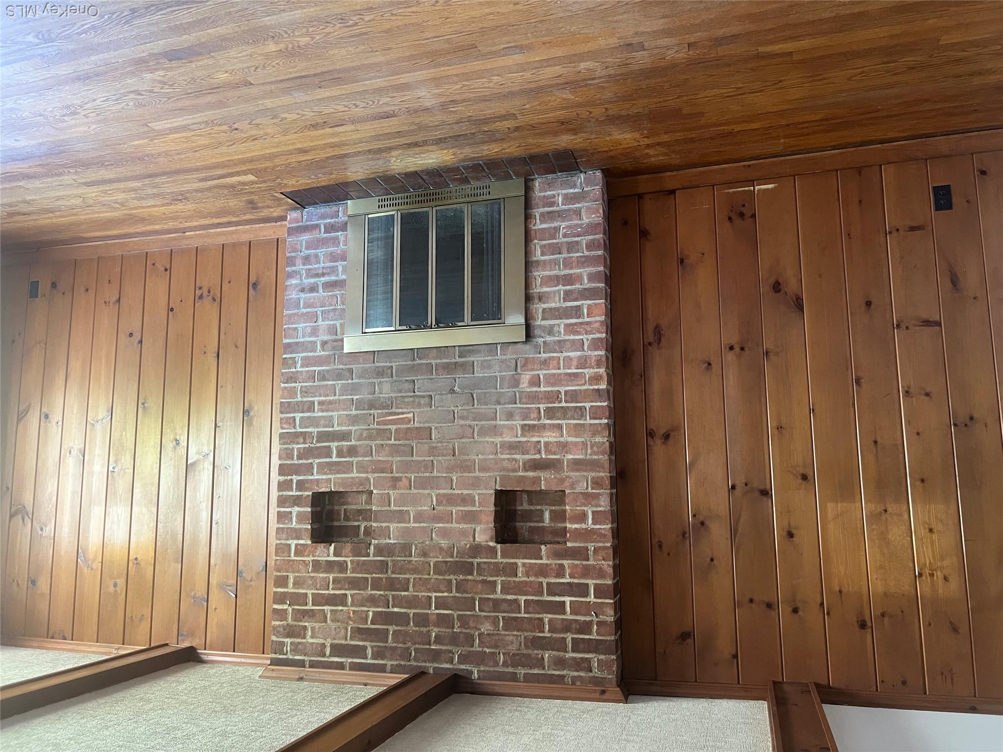 24 Purdue Road Glen Cove, NY 11542 - Photo 13 of 41 a view of a livingroom with wooden floor and a fireplace