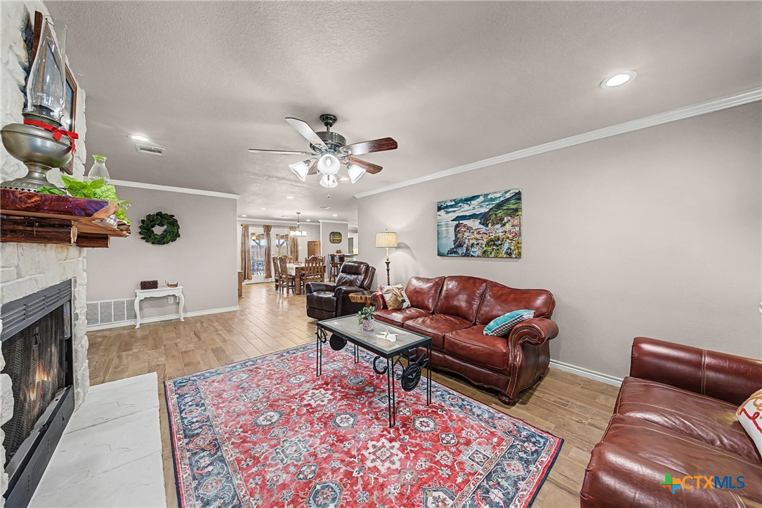 1601 Sunset Circle Cameron, TX 76520 - Photo 10 of 40 a living room with furniture and a fireplace
