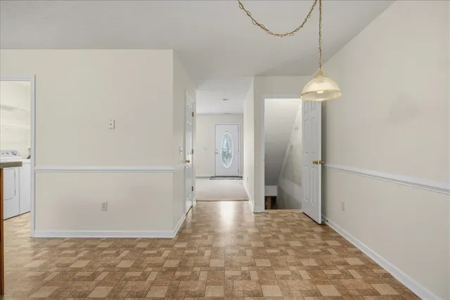 a view of a bathroom with a shower and a sink