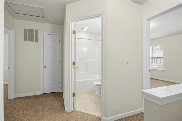 a view of a bathroom with a glass door