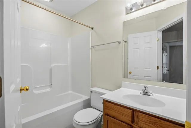 a bathroom with a sink a toilet and a bathtub