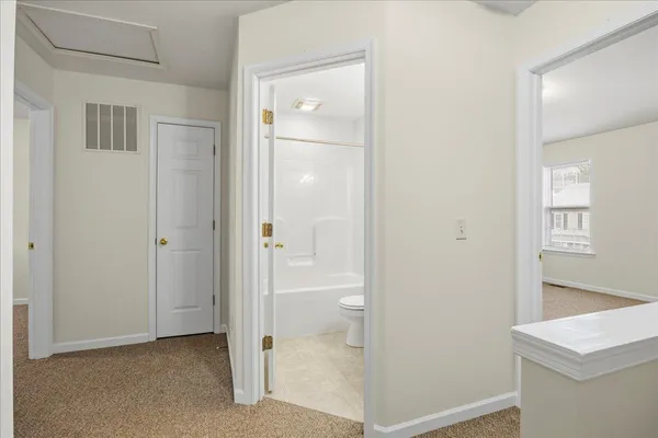a view of a bathroom with a glass door