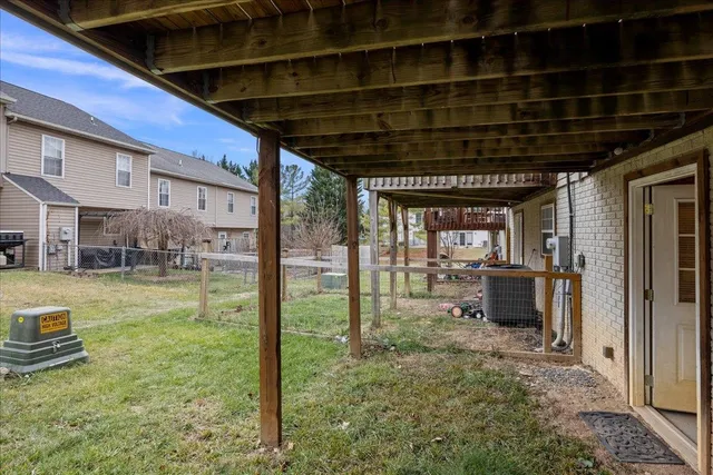 a view of a porch with backyard of a house