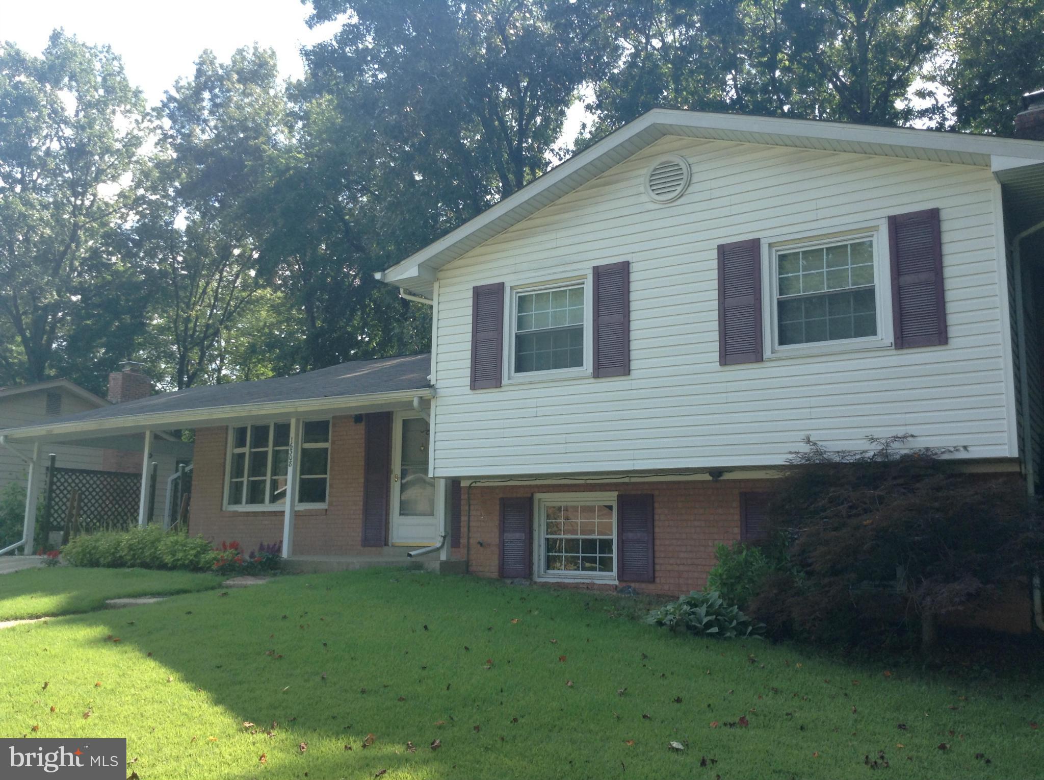 16308 Dahl Road Laurel, MD 20707 - Photo 1 of 9 a front view of a house with a garden
