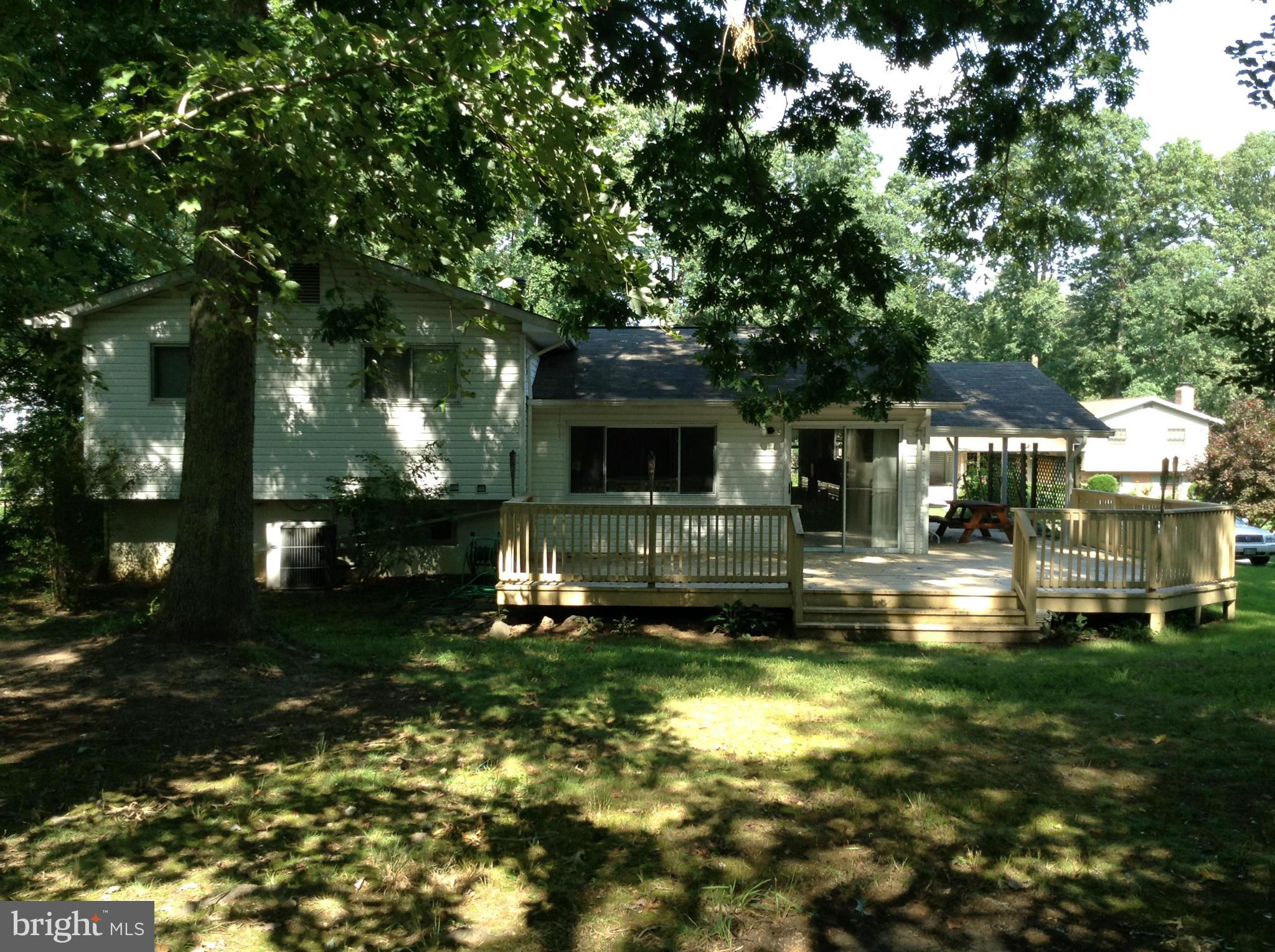 16308 Dahl Road Laurel, MD 20707 - Photo 4 of 9 a front view of a house with a garden