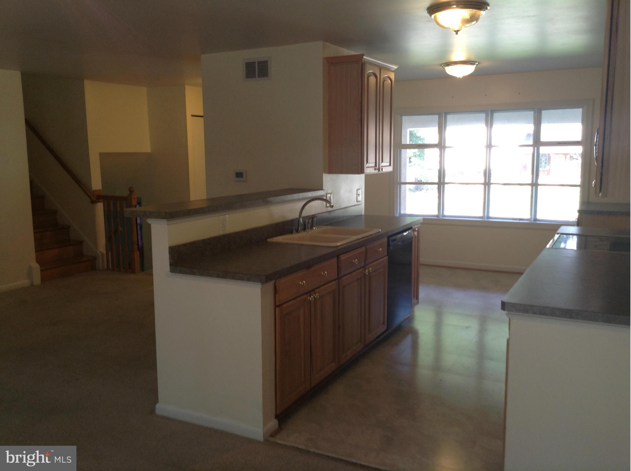 16308 Dahl Road Laurel, MD 20707 - Photo 7 of 9 a kitchen with a sink and a window