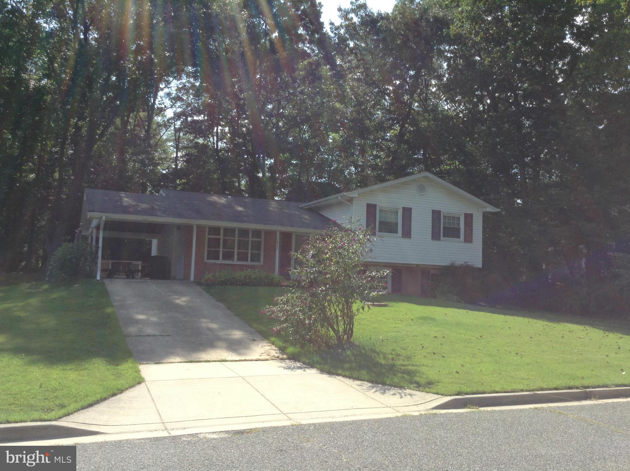 16308 Dahl Road Laurel, MD 20707 - Photo 9 of 9 a front view of a house with a yard and garage