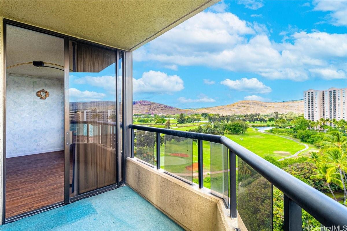 5333 Likini Street, Unit 1110 Honolulu, HI 96818 - Photo 11 of 25 a view of balcony with floor to ceiling windows with wooden floor