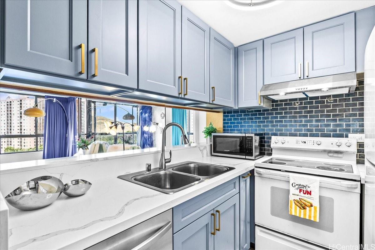 5333 Likini Street, Unit 1110 Honolulu, HI 96818 - Photo 14 of 25 a kitchen with a sink a stove and cabinets