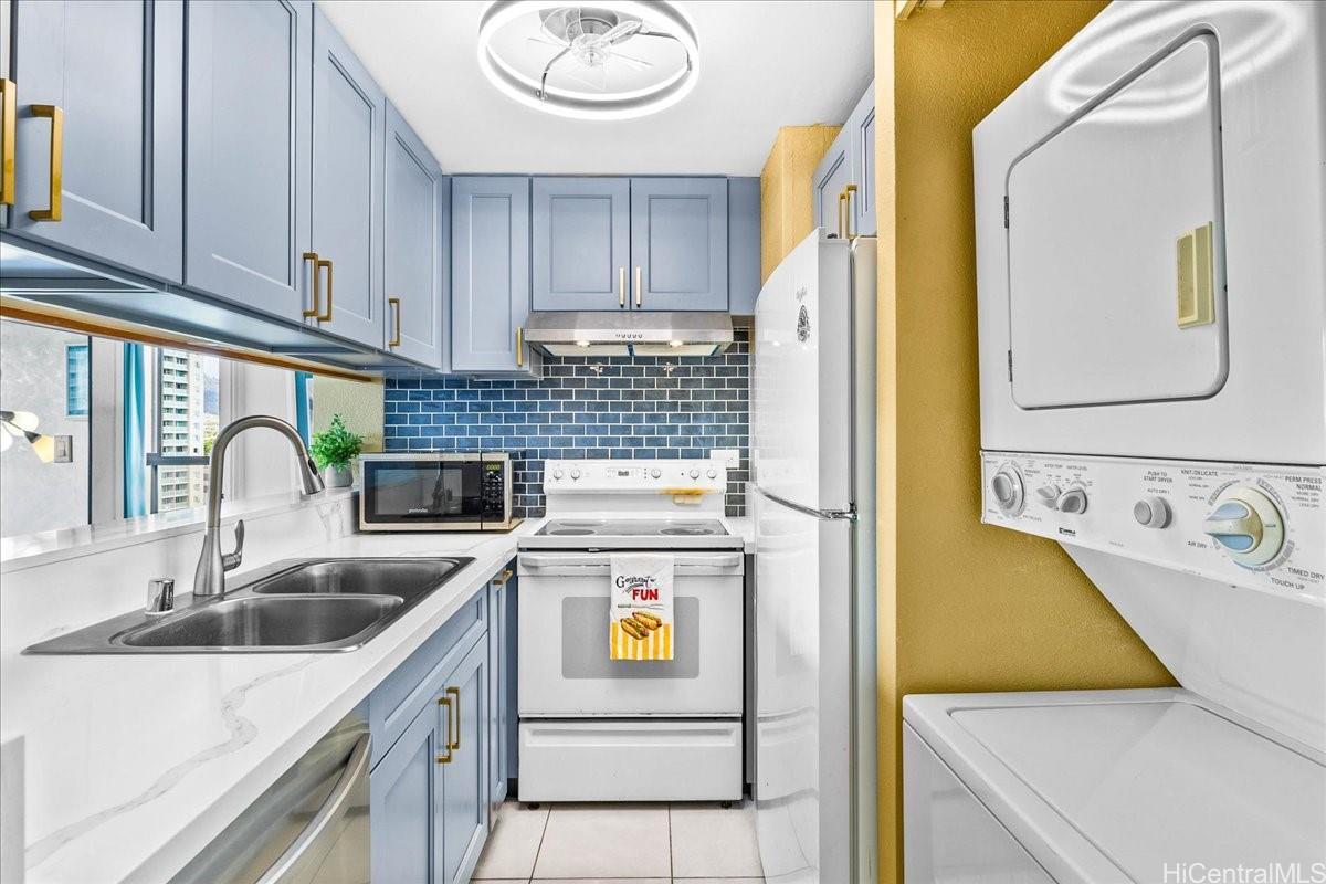 5333 Likini Street, Unit 1110 Honolulu, HI 96818 - Photo 15 of 25 a kitchen with a sink and a refrigerator