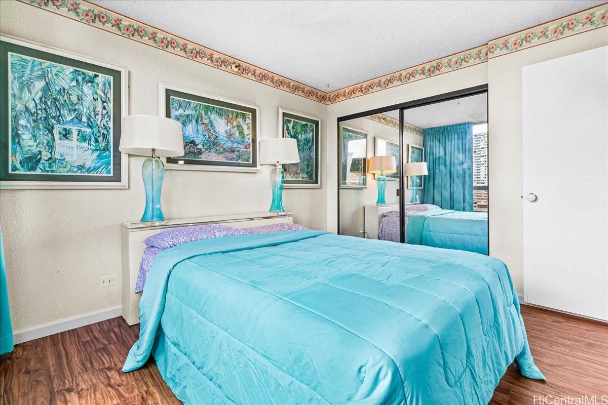 5333 Likini Street, Unit 1110 Honolulu, HI 96818 - Photo 18 of 25 a bedroom with a large bed and a window