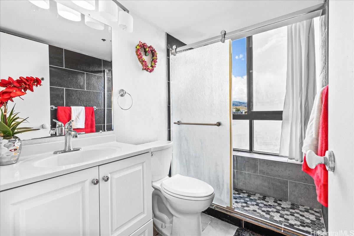 5333 Likini Street, Unit 1110 Honolulu, HI 96818 - Photo 19 of 25 a bathroom with a sink toilet and shower