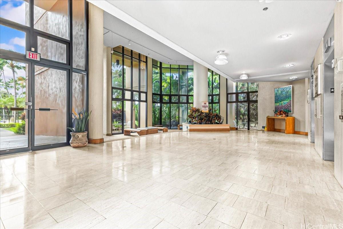 5333 Likini Street, Unit 1110 Honolulu, HI 96818 - Photo 6 of 25 a view of an entryway with a floor to ceiling window
