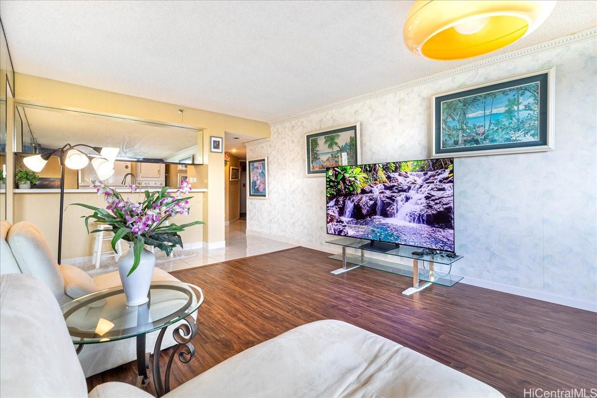 5333 Likini Street, Unit 1110 Honolulu, HI 96818 - Photo 9 of 25 a living room with furniture and flowers