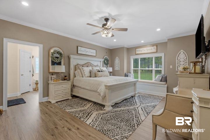 24541 Baldwin Beach Expressway Robertsdale, AL 36567 - Photo 15 of 51 Bedroom with baseboards, recessed lighting, crown molding, and light wood finished floors
