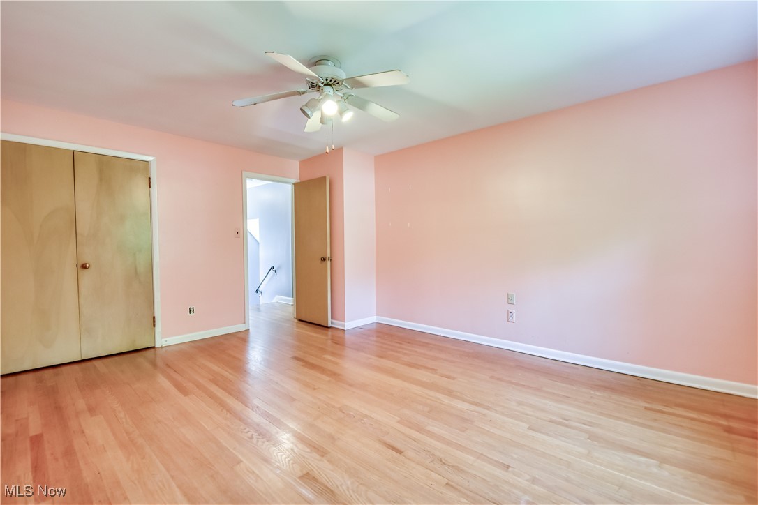 2607 Ashurst Road University Heights, OH 44118 - Photo 28 of 39 Unfurnished bedroom featuring light wood finished floors, ceiling fan, and a closet