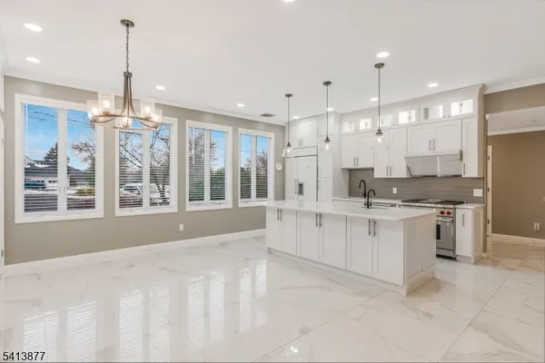 a kitchen that has a stove and a sink