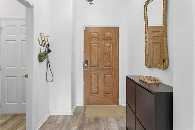 a bathroom with a granite countertop shower and a sink