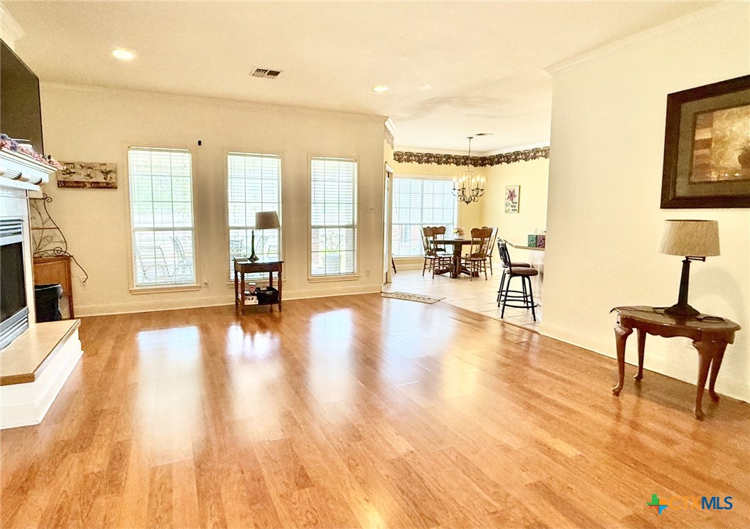 415 South Trinity Street Edna, TX 77957 - Photo 6 of 46 a view of a living room filled with furniture and a wooden floor