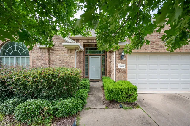 front view of a house with garden