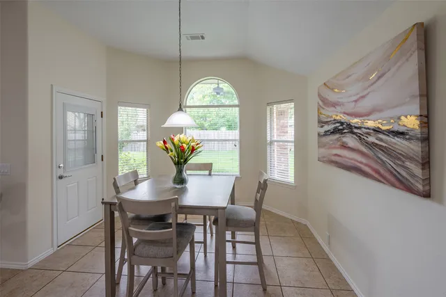 a kitchen with stainless steel appliances granite countertop a stove top oven a sink and dishwasher