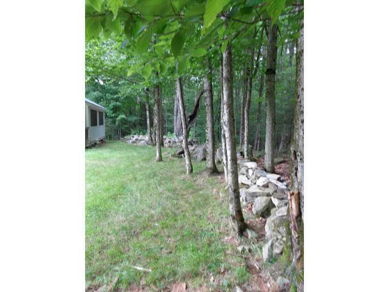 419 Fuller Road Carmel, ME 04419 - Photo 23 of 34 Back Yard. Lovely stone wall adds...
